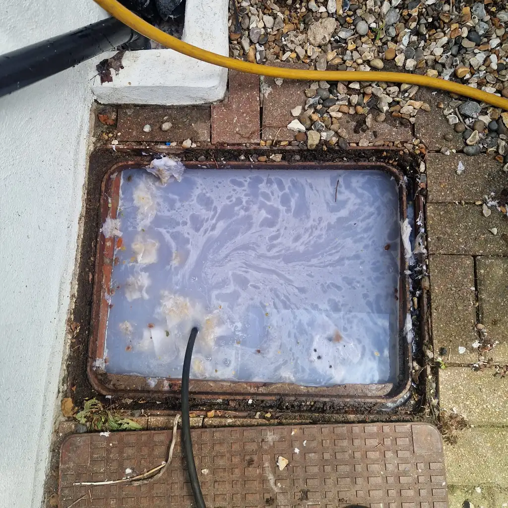 Blocked inspection chamber that turned out to be a collapsed drain requiring excavation