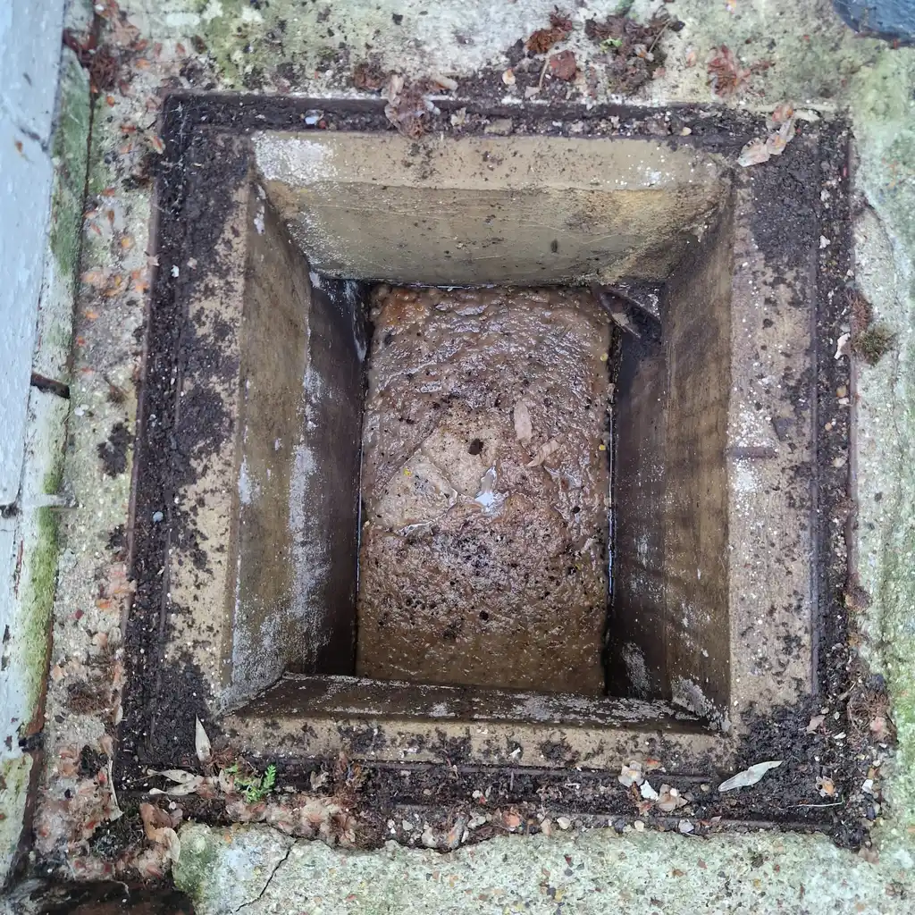 Inspection chamber cleared after a downstream toilet blockage