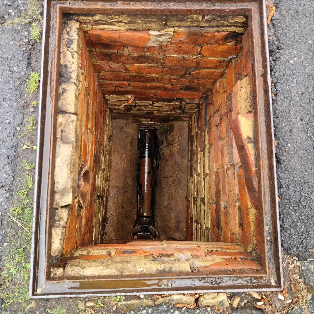 Deep brick inspection chamber with clay channel after cleaning and inspection