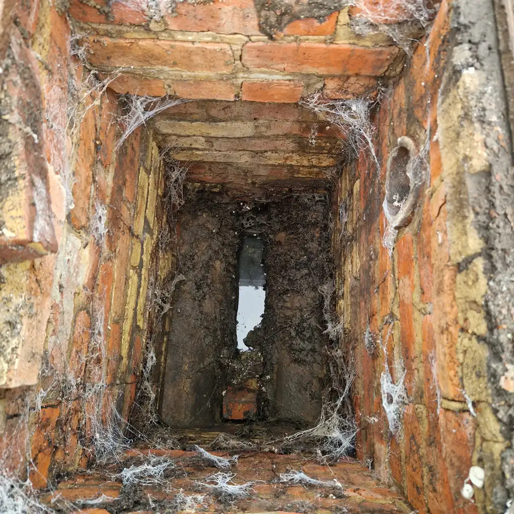 Brick inspection chamber cleared during a no call-out fee blocked drain visit in South East England