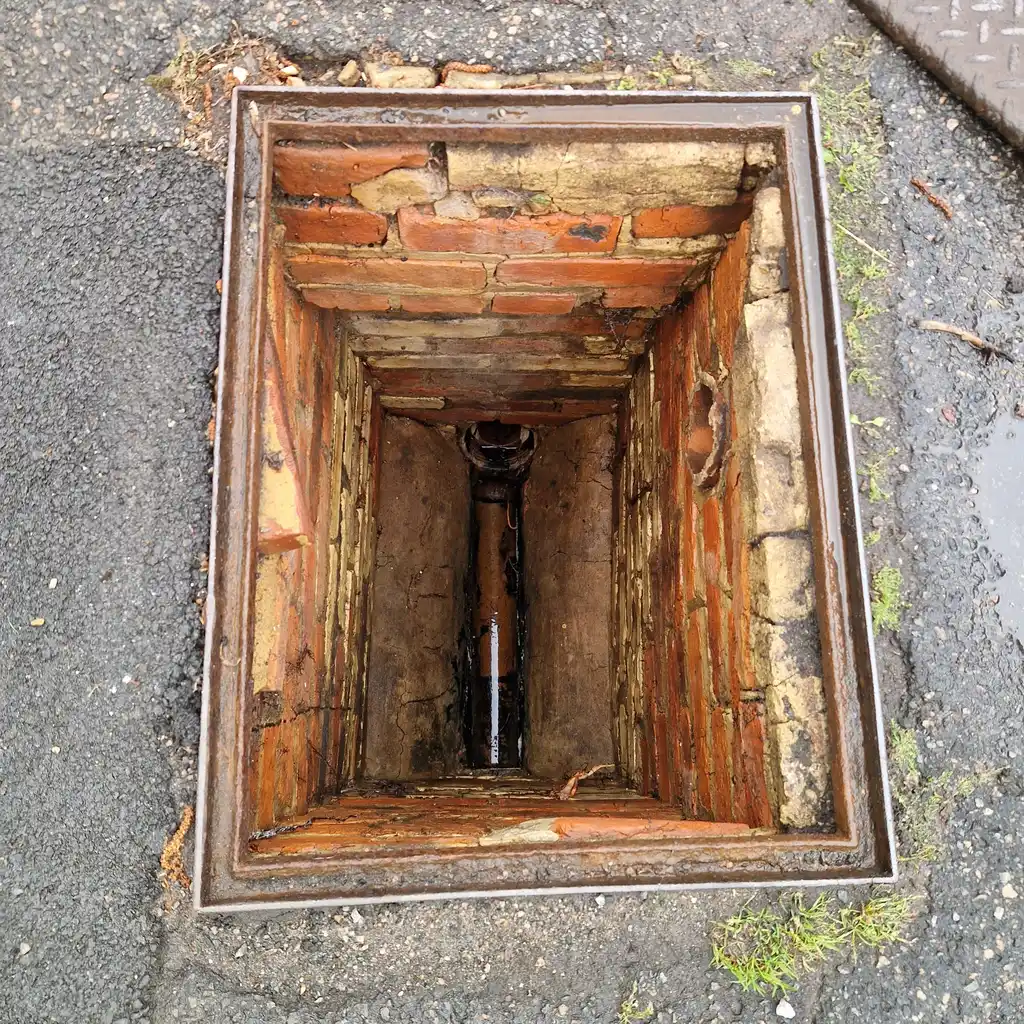 Brick inspection chamber used as access point during drain relining