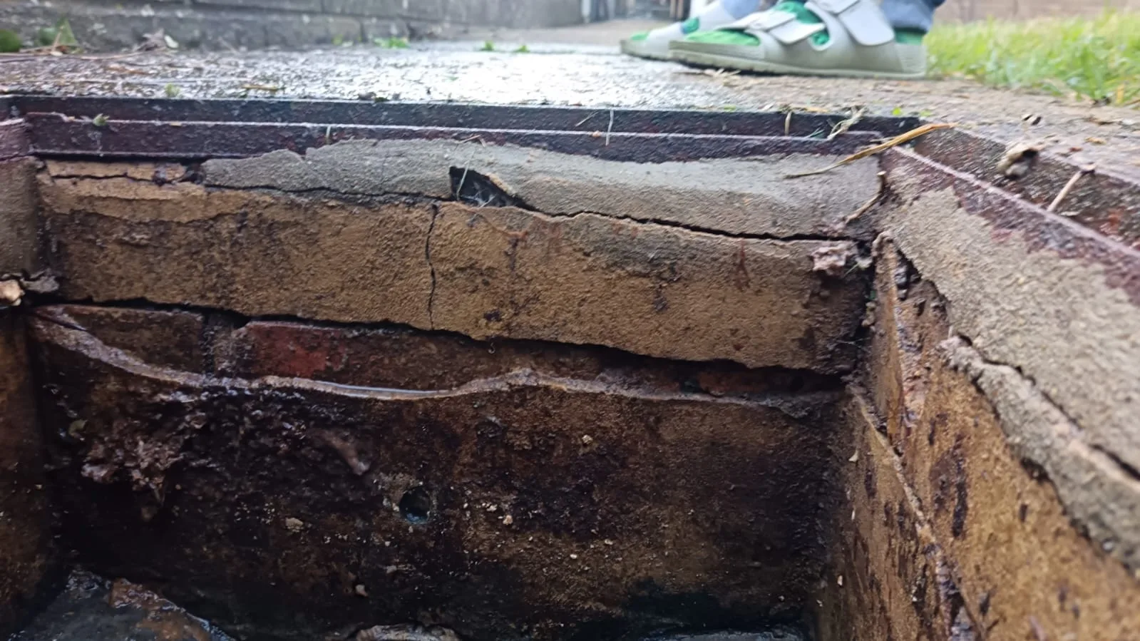 Damaged chamber brickwork found during an external drain blockage investigation