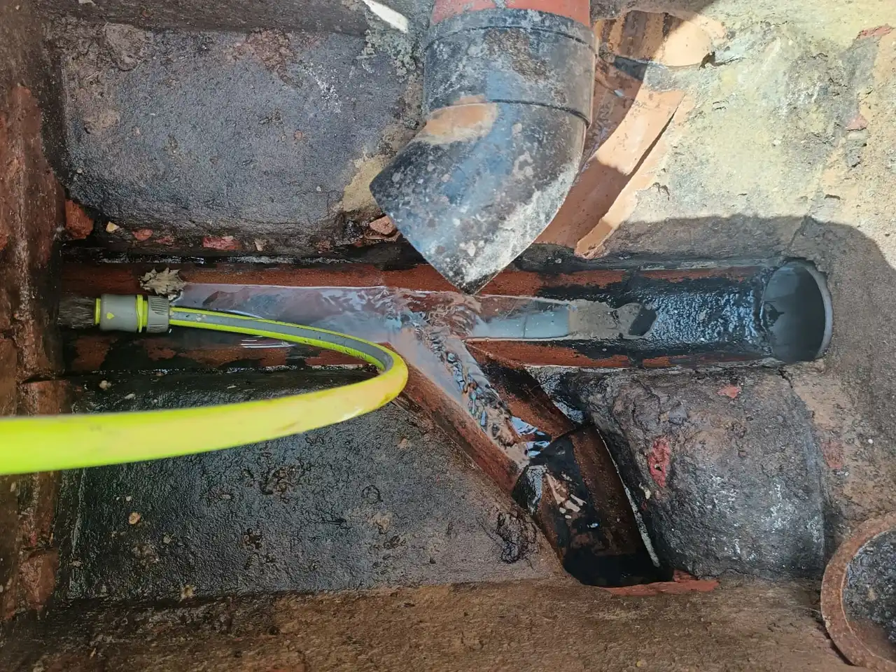 Flow test being carried out on a drain chamber to check for blockage