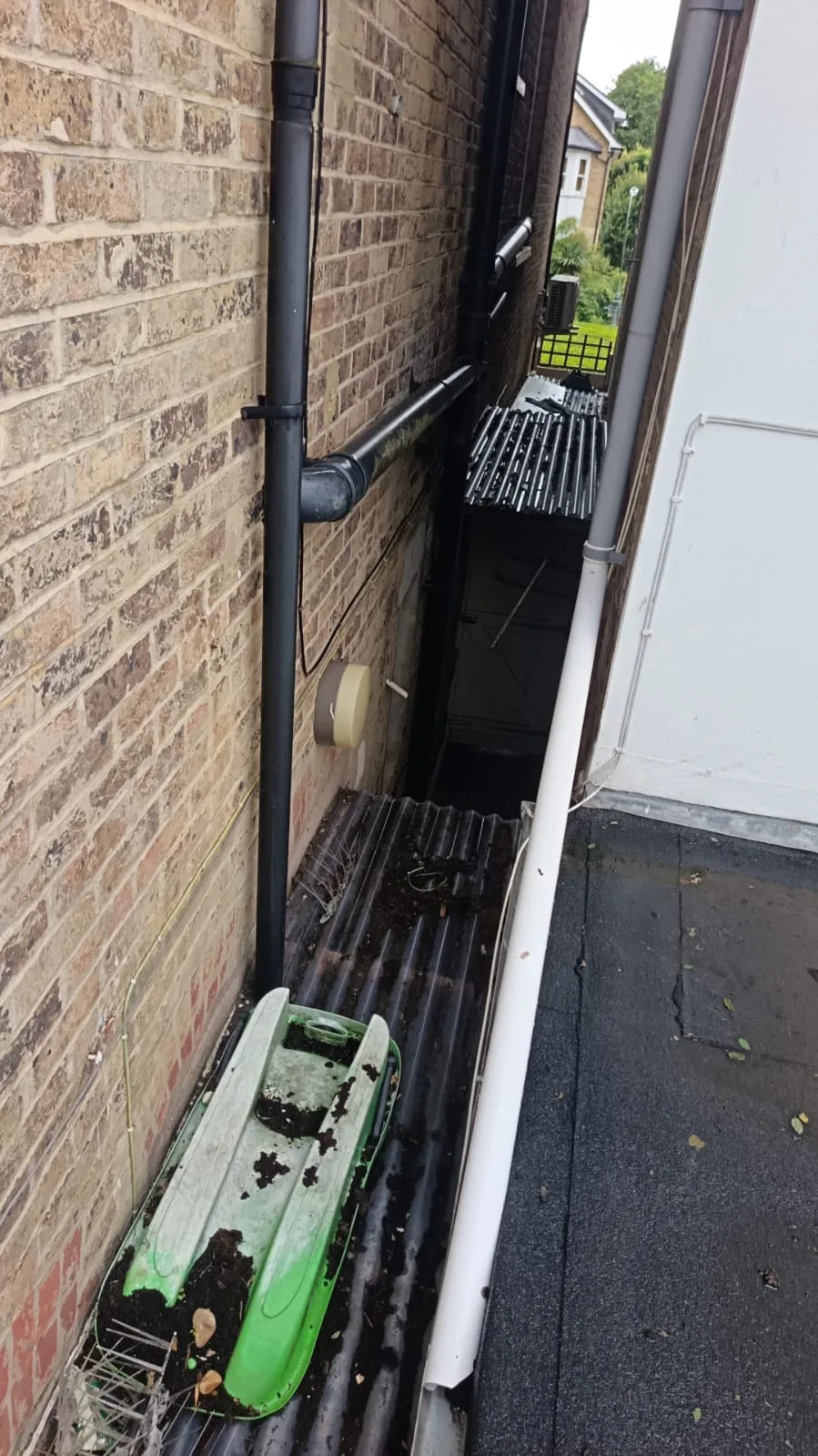 External soil stack pipework connected to a drain unblocking DIY project