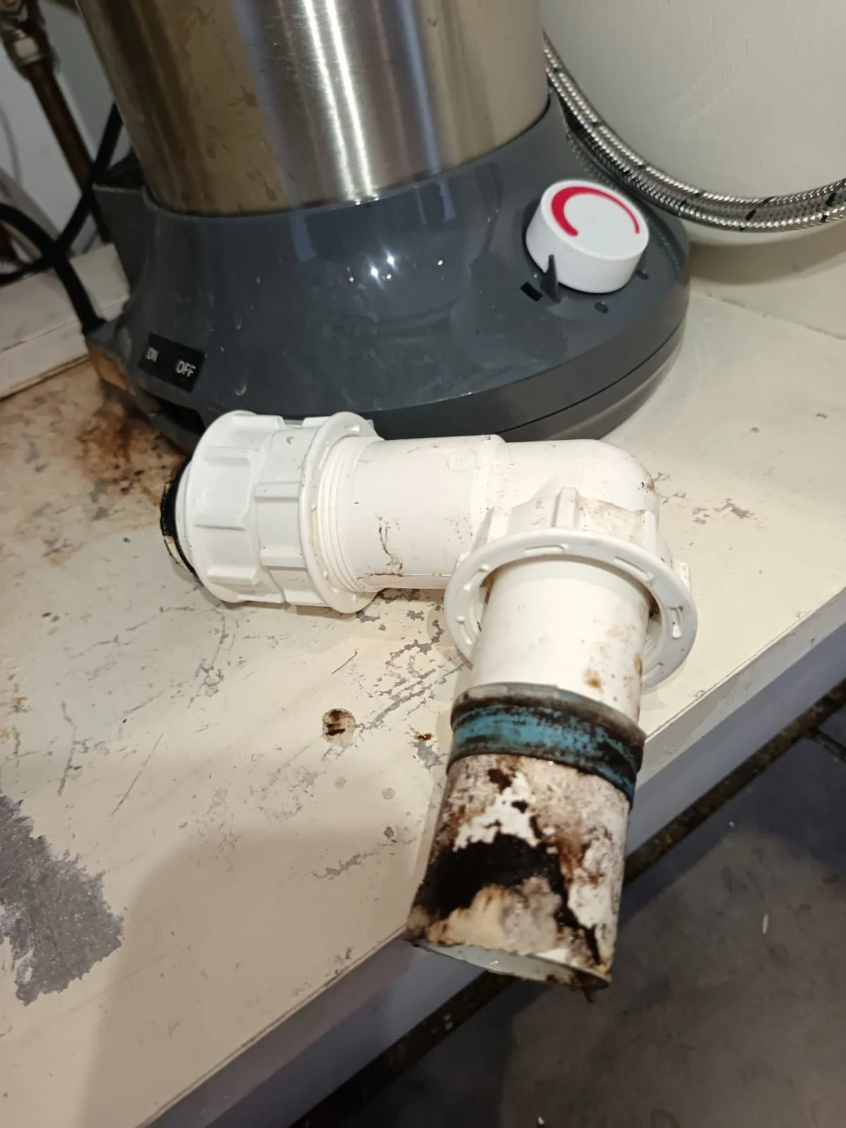 Fouled waste pipe removed during clearing outside drains job